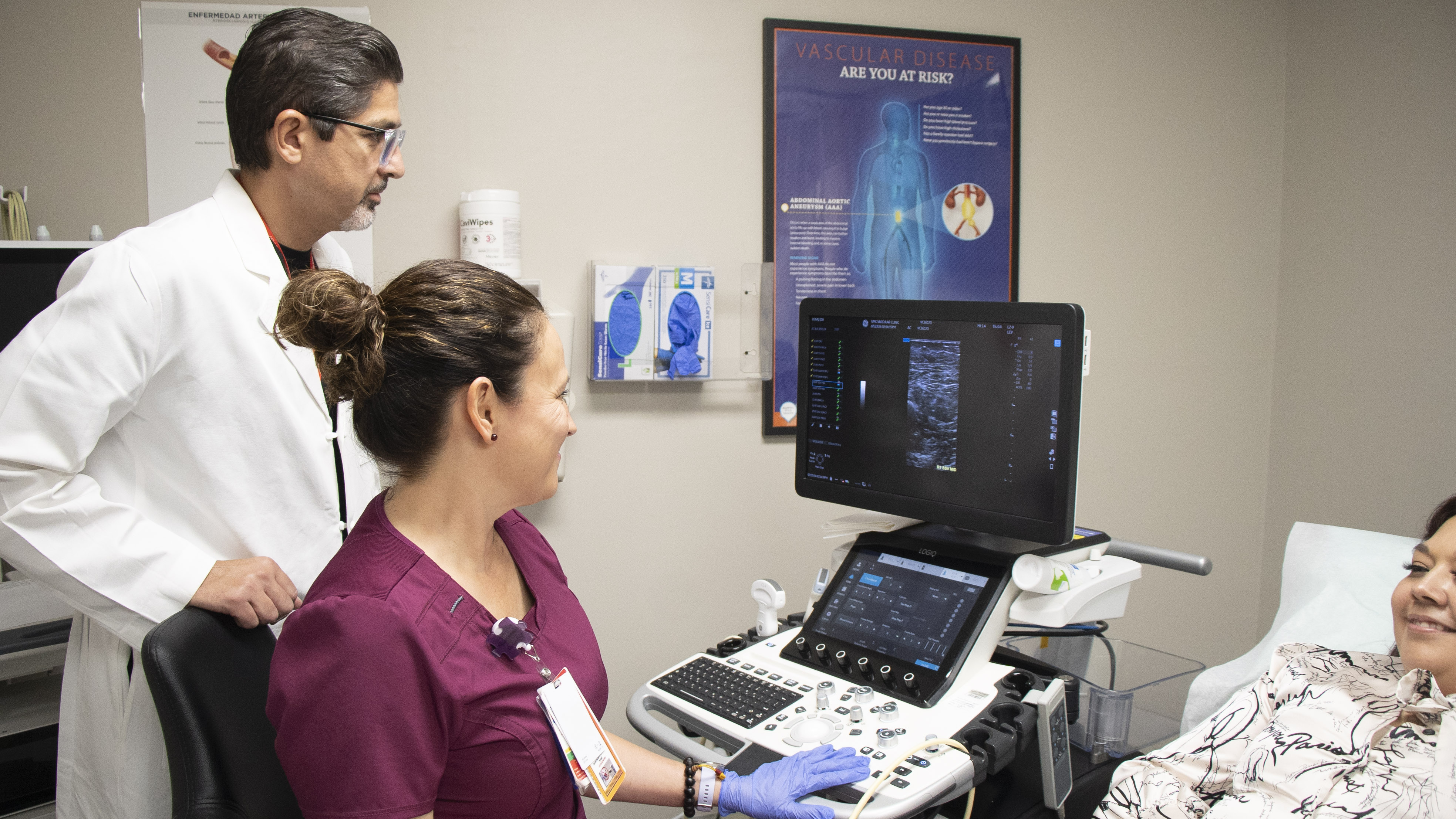Dr. Aidinian can be seen communicating with a patient.